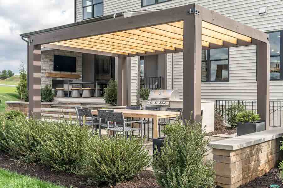 Modern patio with pergola and outdoor seating area.