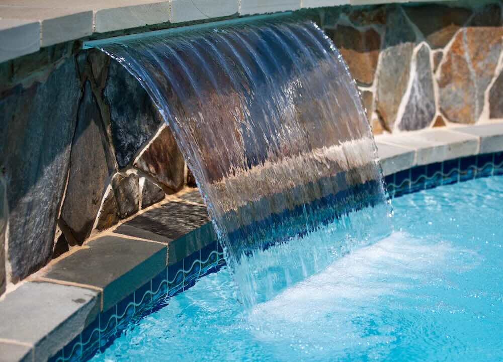 Waterfall feature in swimming pool